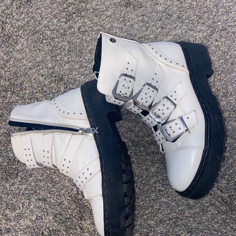 White leather boots with buckles